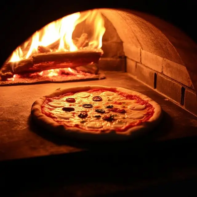 Pizza baking in a hot wood-fired oven